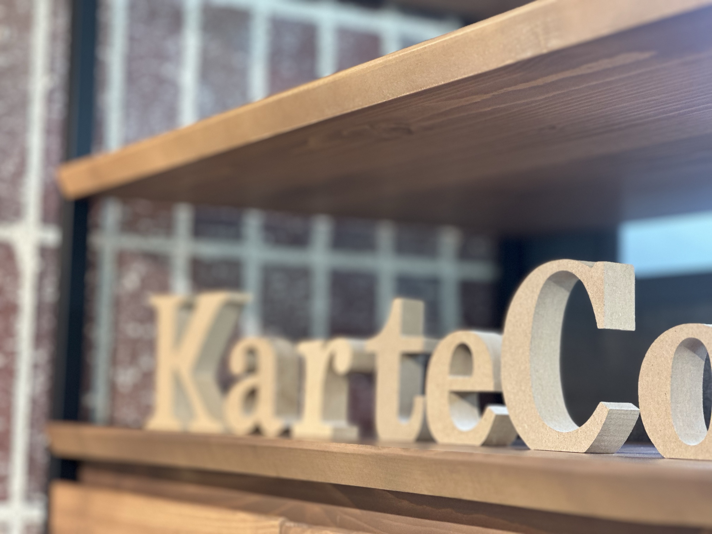Wooden KarteCo lettering on a shelf